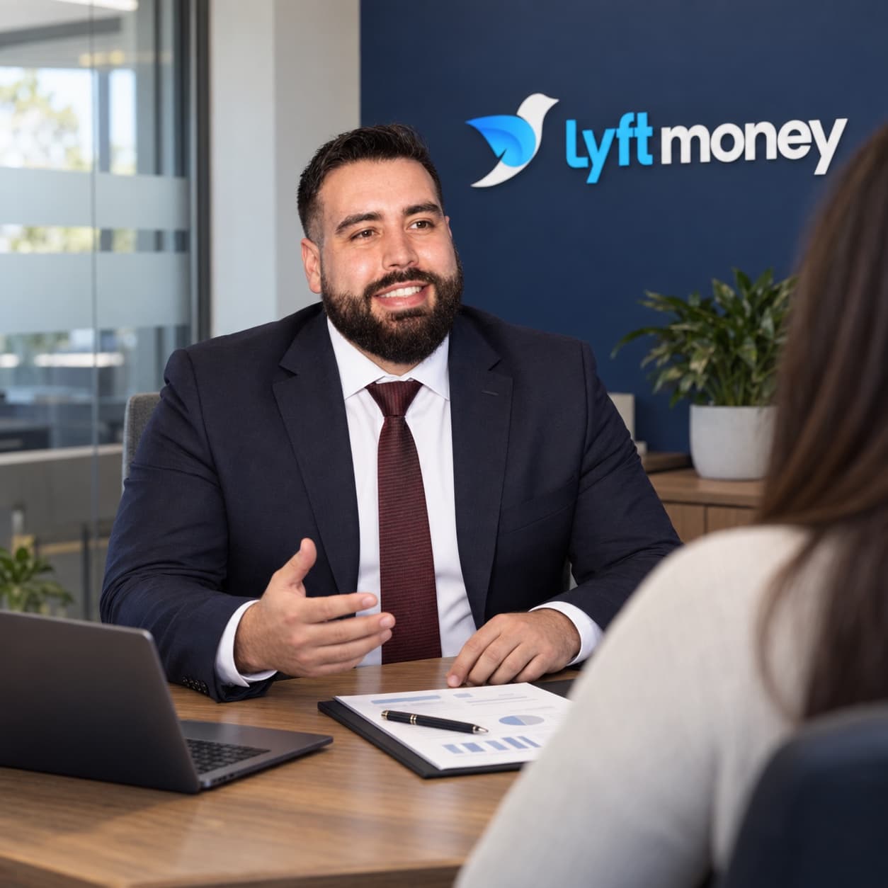 Kris, Lyft Money co-founder, comparing lender quotes at his desk